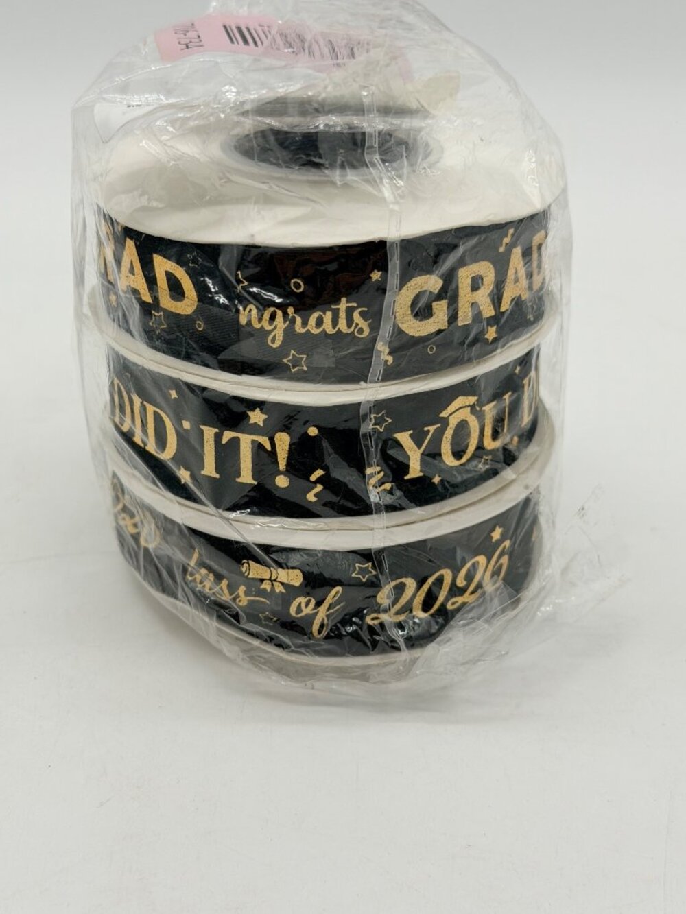 set of black ribbon with gold "Congrats Grad" and "Class of 2026" lettering.
